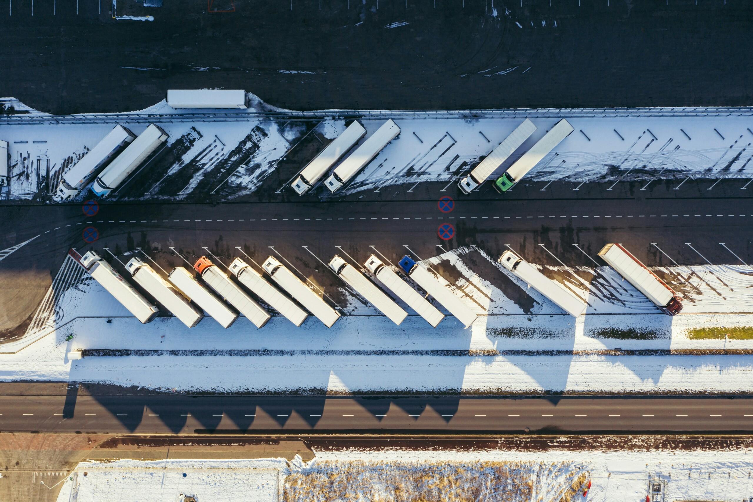 Aerial view of parking space and trucks