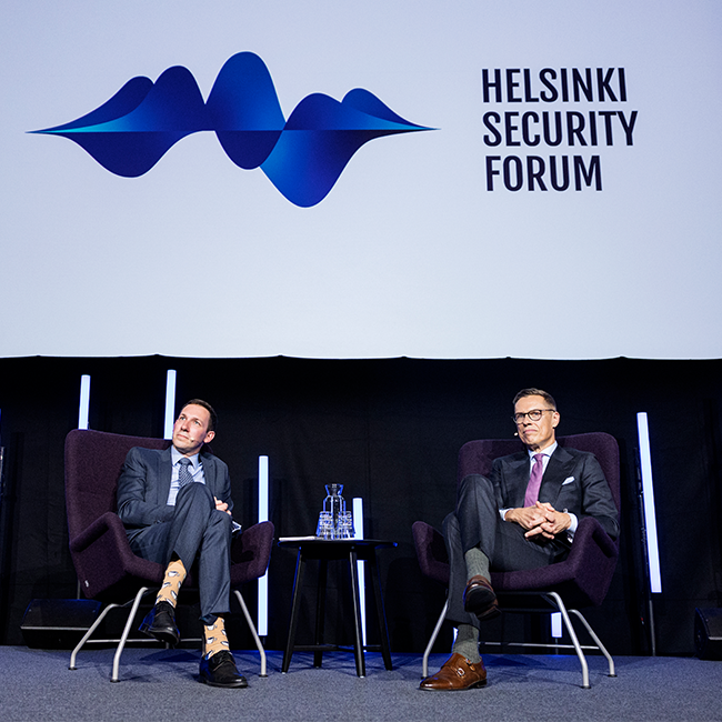 Helsinki Security Forum, President Alexander Stubb and Henry Foy on stage.