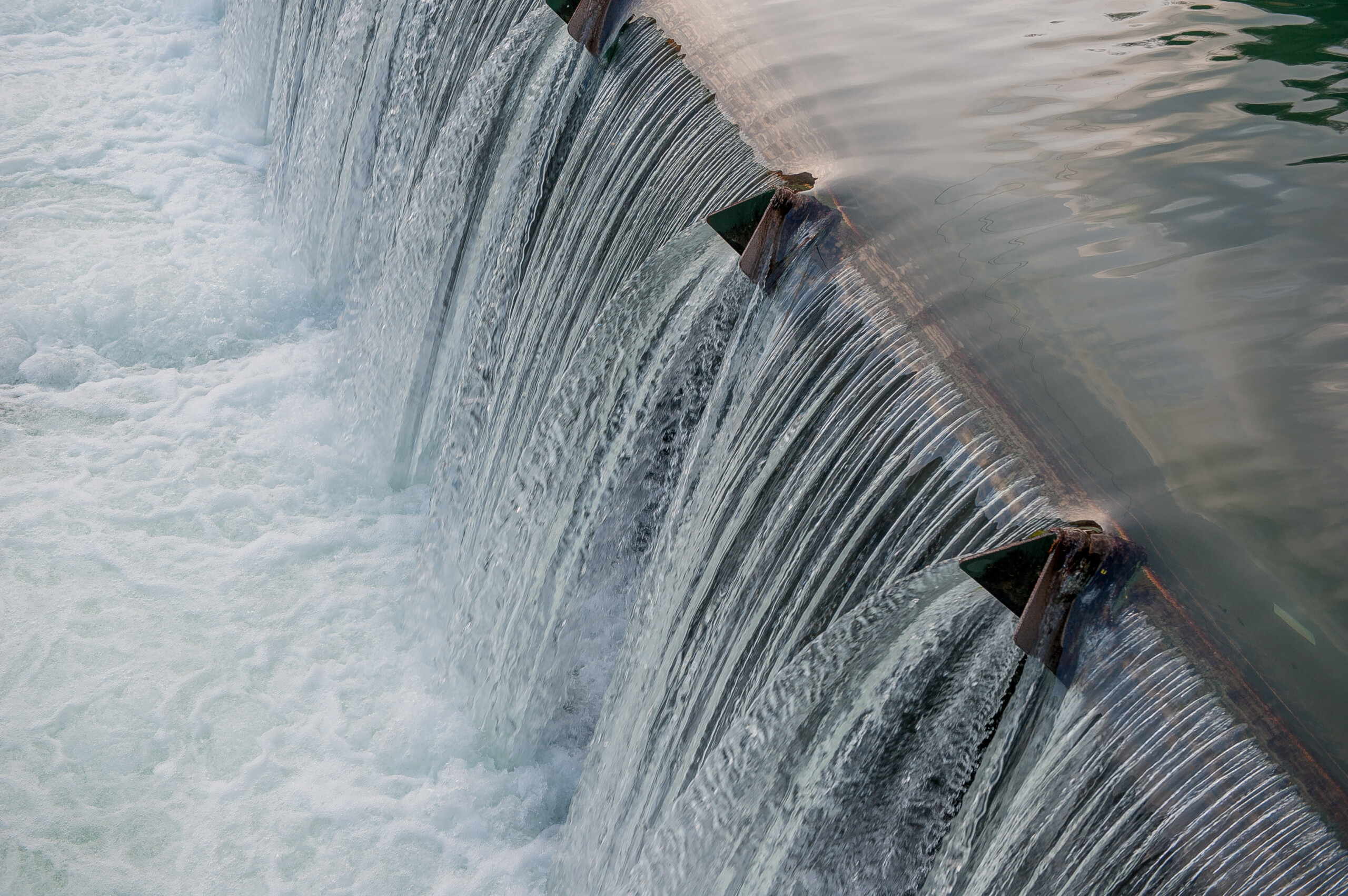 Close-up of water streaming down from a dam