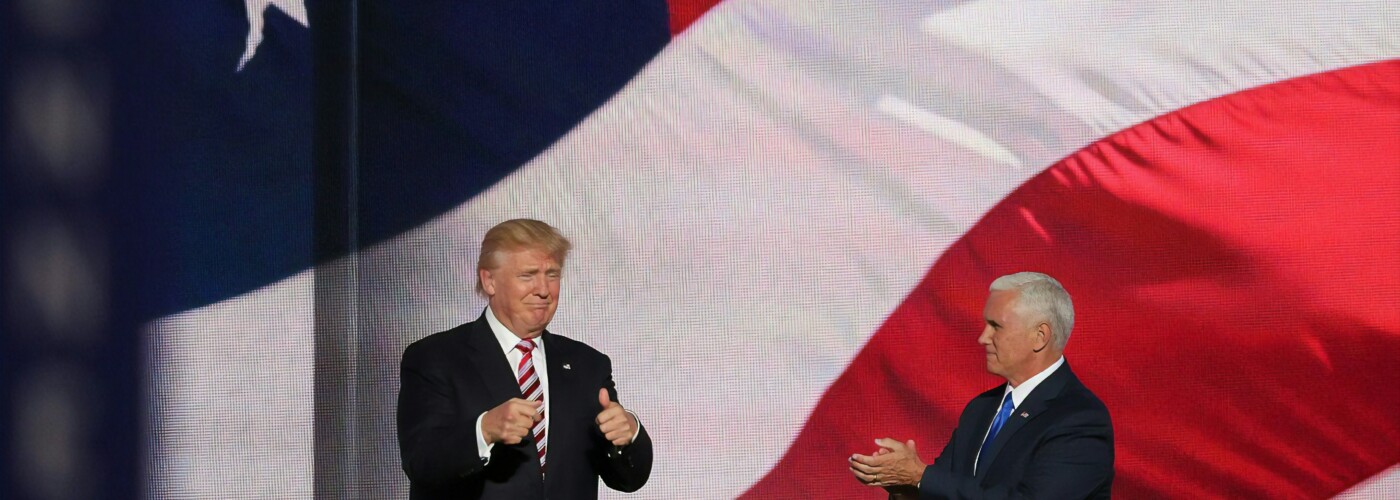 Donald Trump in front of US flag.