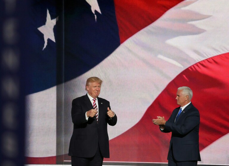 Donald Trump in front of US flag.