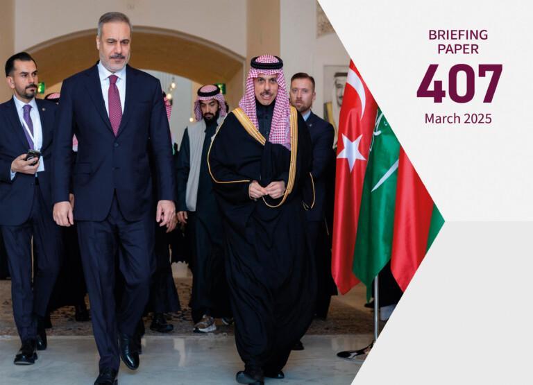 Cover photo for the publication. Saudi Minister of Foreign Affairs Faisal bin Farhan meets with Turkish Foreign Minister Hakan Fidan in Riyadh on 28 January 2025. The background displays Turkish and Saudi flags along with other attendees.