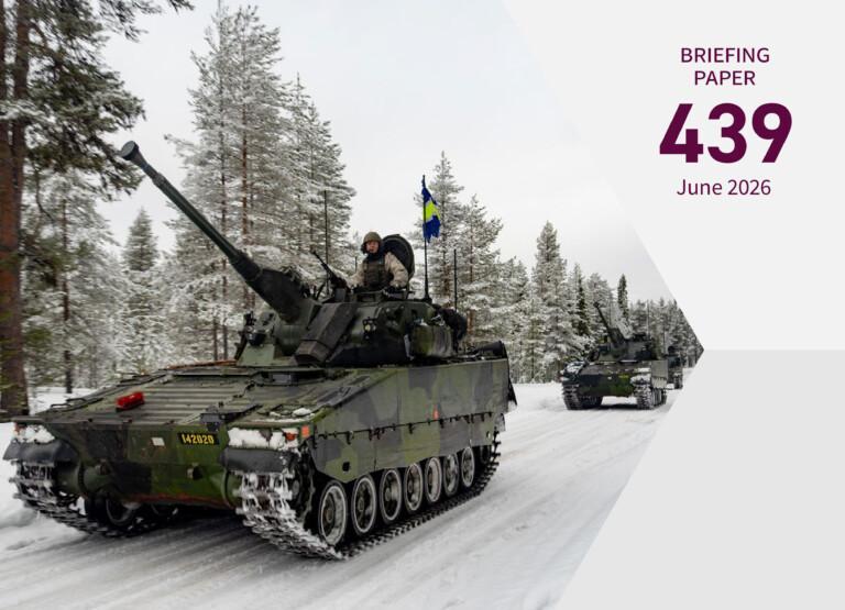 Cover page of the publication depicting two military tanks driving forward on a snowy road in a forest.
