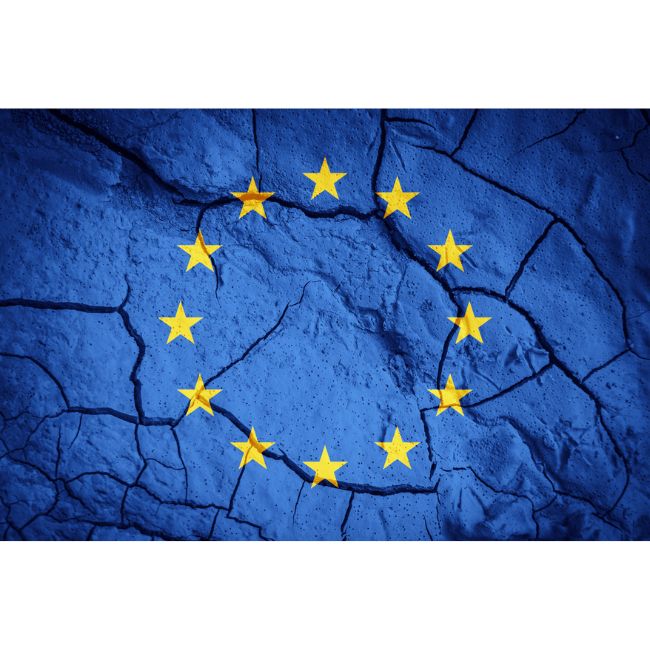 Flag of the European Union on the background of dry cracked earth.
