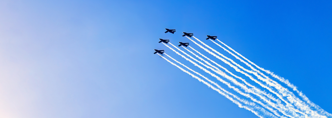 Six fighter planes flying in form.